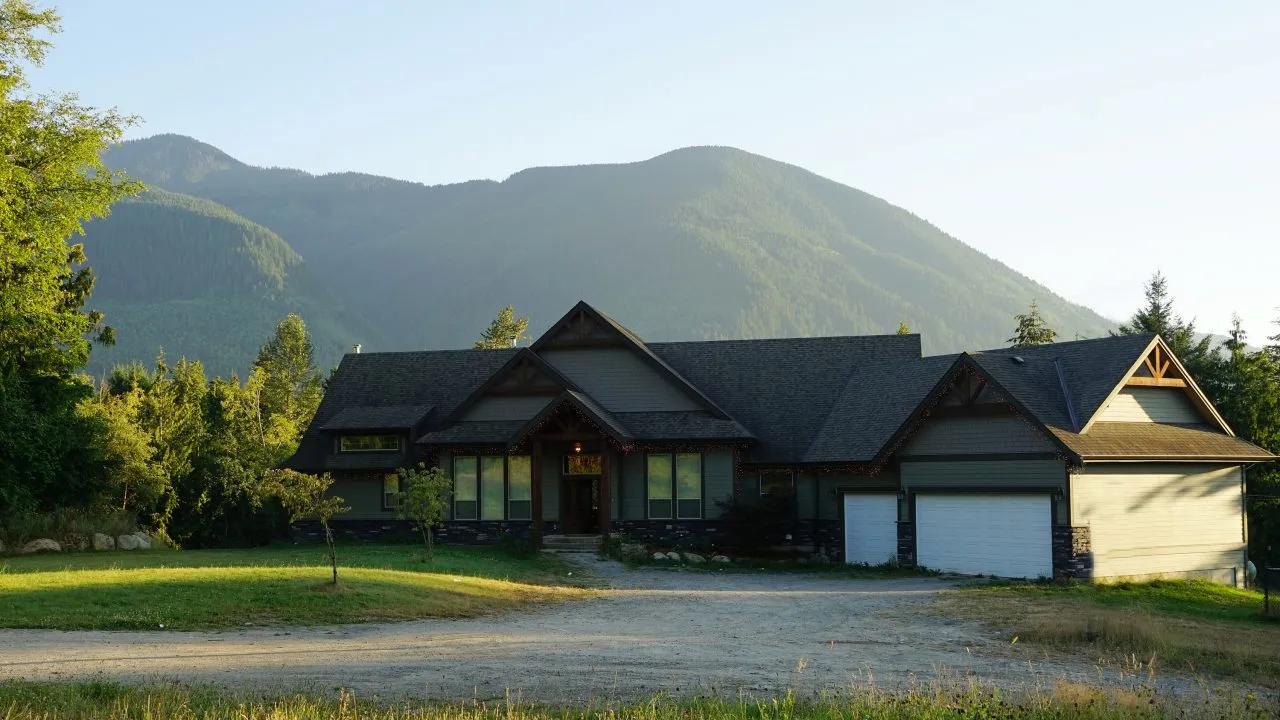 Santé farmhouse framed by the mountains of Ryder Lake, Chilliwack, British Columbia