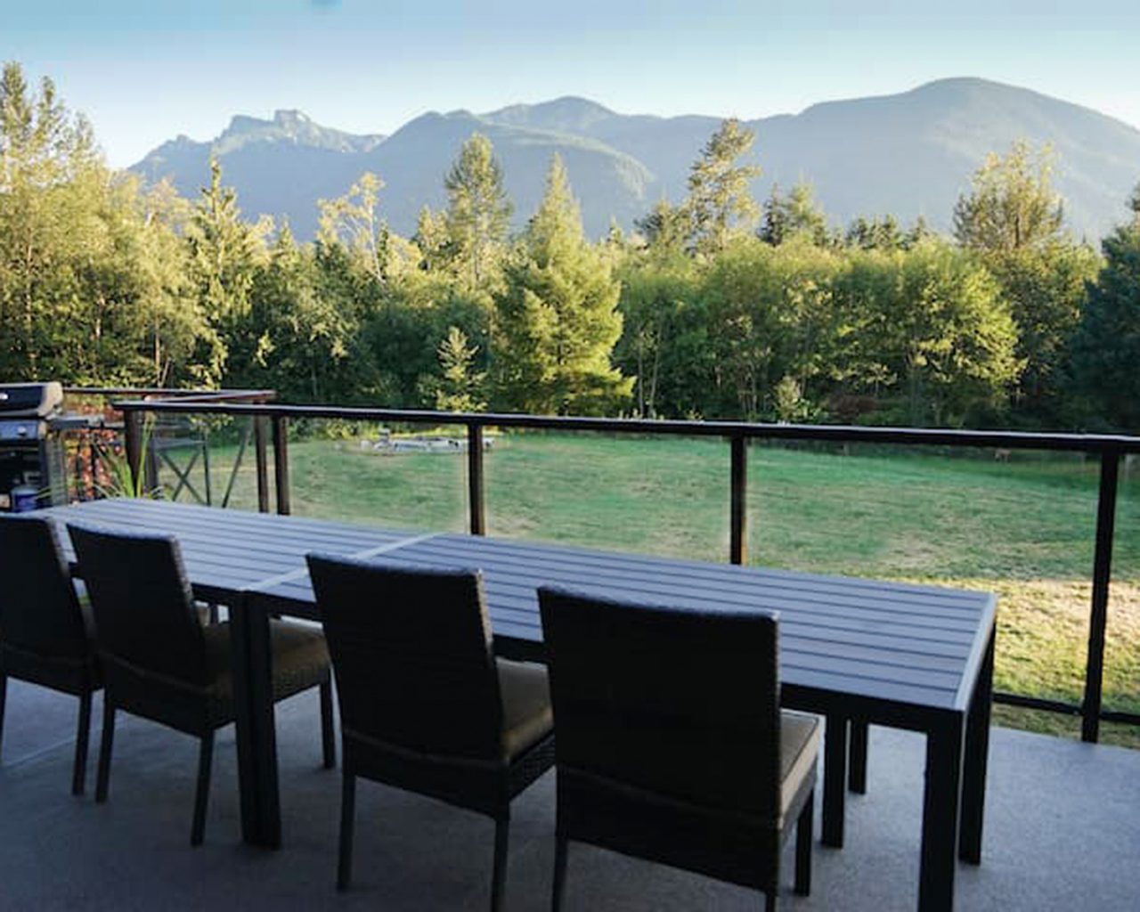 The upper deck of the Rustic Farmhouse overlooking 16 acres of forest and valley