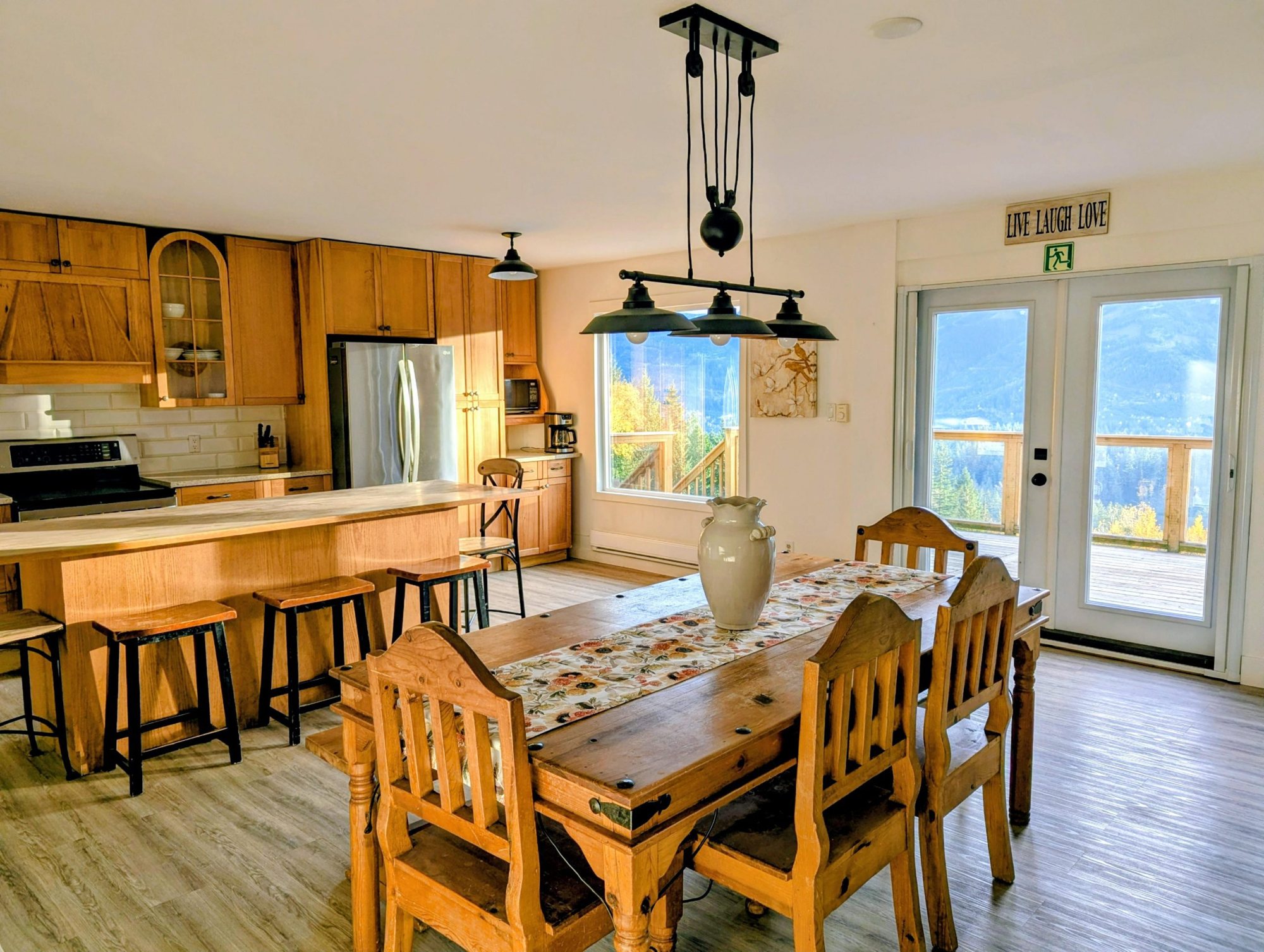 Full farmhouse kitchen with wood dining table at Santé Wellness Retreat