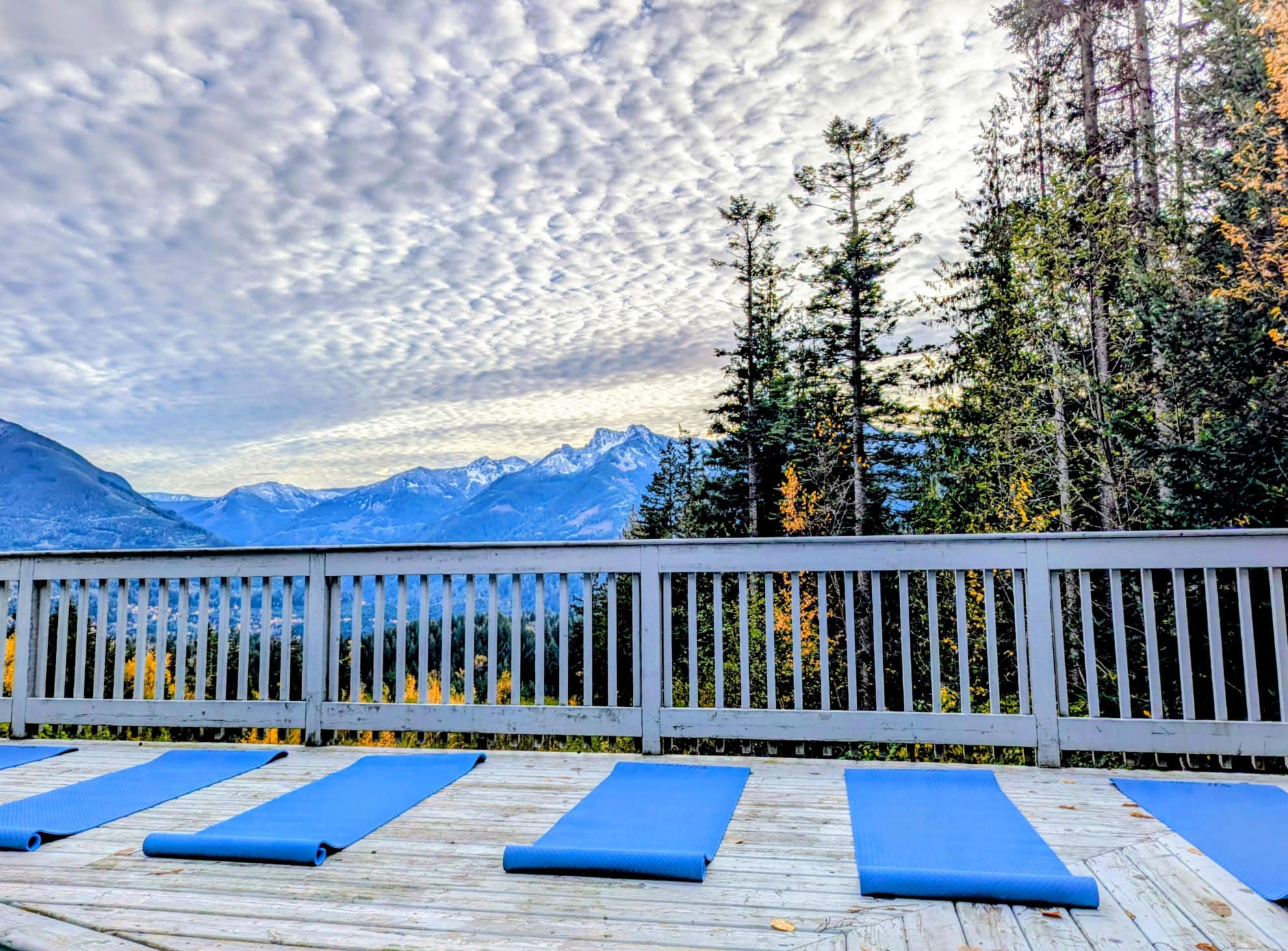 Sundeck with yoga mats overlooking the mountains at Santé Wellness Retreat